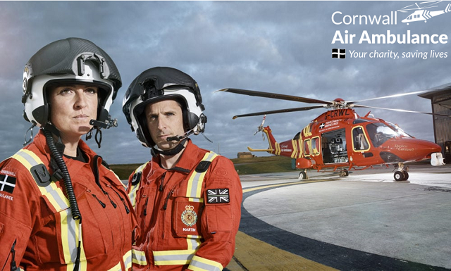 Cornwall Air Ambulance pilots in front of helicopter
