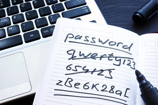 Strong and weak easy Password. Note pad and laptop.