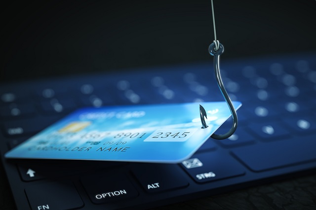 phishing credit card data with keyboard and hook symbol