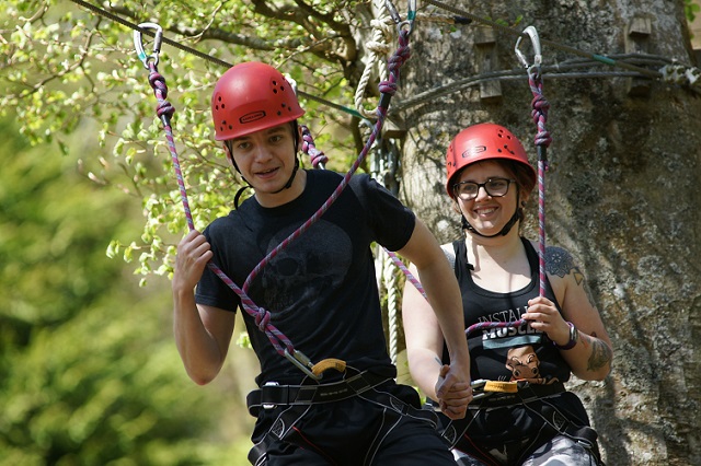 Yacer Sellam, Remote IT Support Expert at Intersys, in red helmet, preparing to launch on a zip wire.