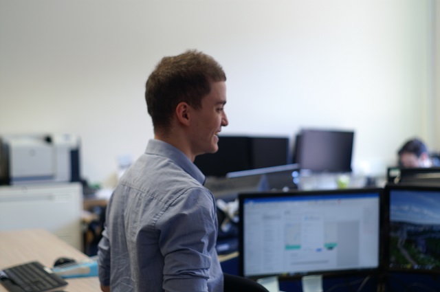 Remote IT Support Engineer Yacer Sellam, in profile wearing a light blue shirt.