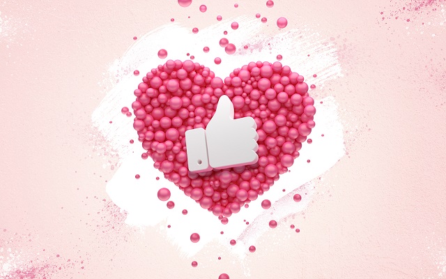 Social media likes concept with pink heart and thumbs up button